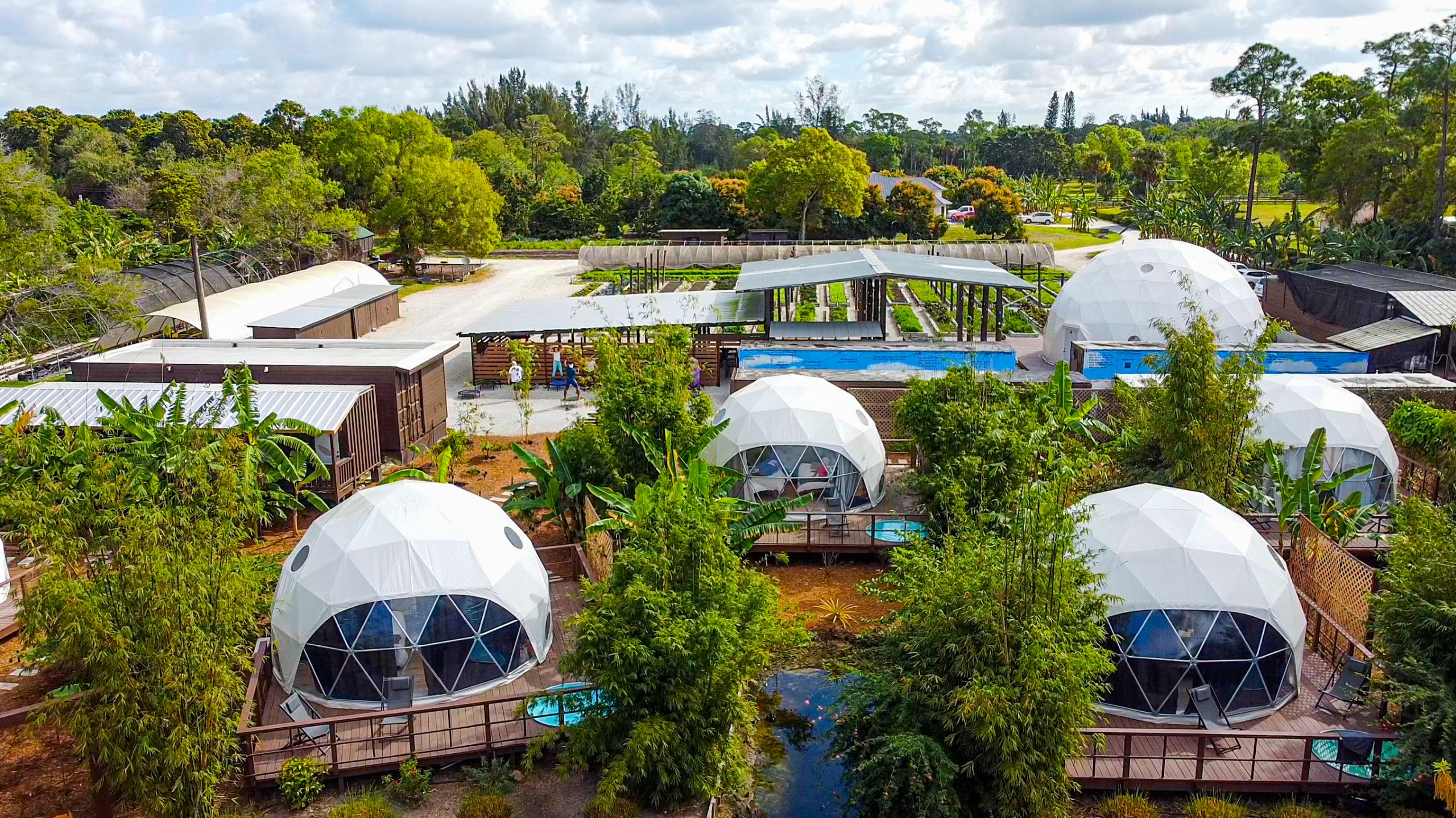 Aerial view of the glamping domes and organic gardens at Gratitude Garden Farm